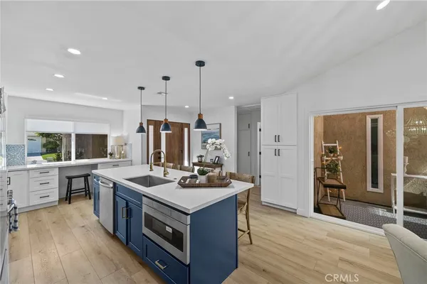 a kitchen with stainless steel appliances granite countertop a stove and a refrigerator