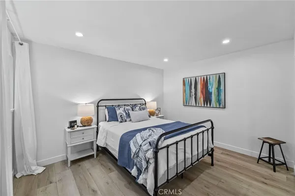 a bedroom with a bed and a desk