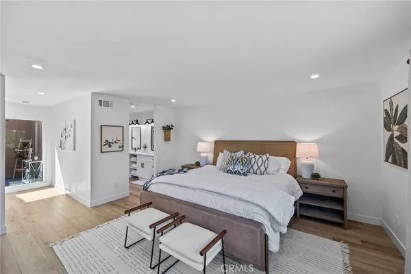 a bedroom with a bed and a table