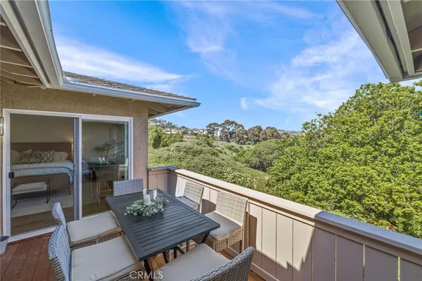 a view of balcony with furniture and wooden deck