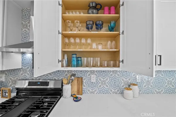 a utility room with cabinets dryer and washer