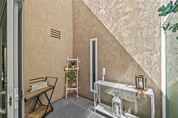 a view of balcony with furniture