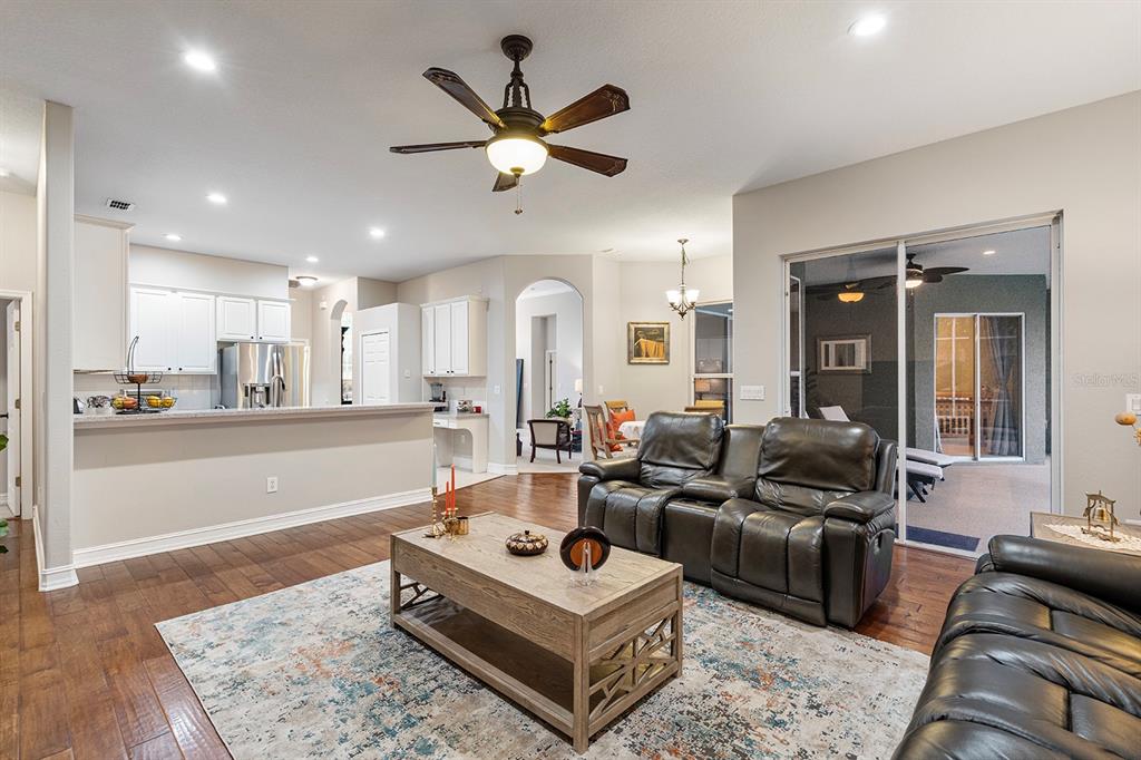 5713 Oak Lake Trail Oviedo, FL 32765 - Photo 13 of 52 a living room with furniture and a wooden floor
