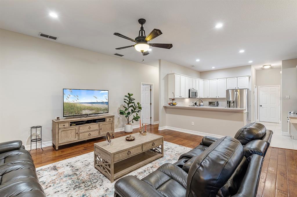 5713 Oak Lake Trail Oviedo, FL 32765 - Photo 14 of 52 a living room with furniture and a flat screen tv