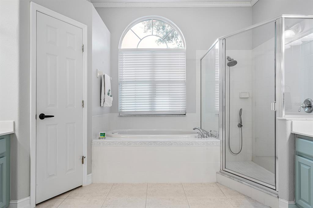 5713 Oak Lake Trail Oviedo, FL 32765 - Photo 23 of 52 a bathroom with a bathtub a shower and a sink