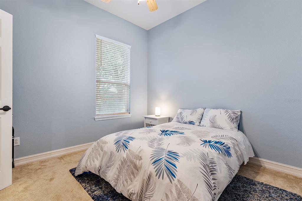 5713 Oak Lake Trail Oviedo, FL 32765 - Photo 29 of 52 a bedroom with bed and window