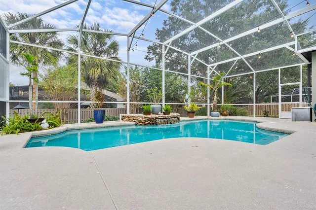 a view of small yard with a swimming pool