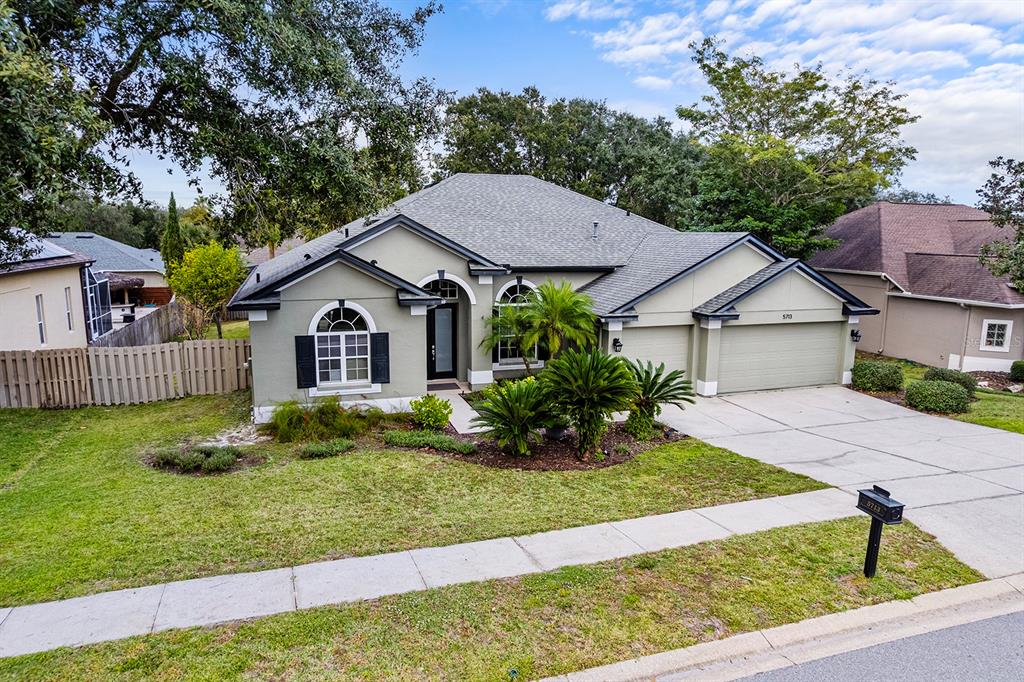 5713 Oak Lake Trail Oviedo, FL 32765 - Photo 36 of 52 a view of house with backyard and garden