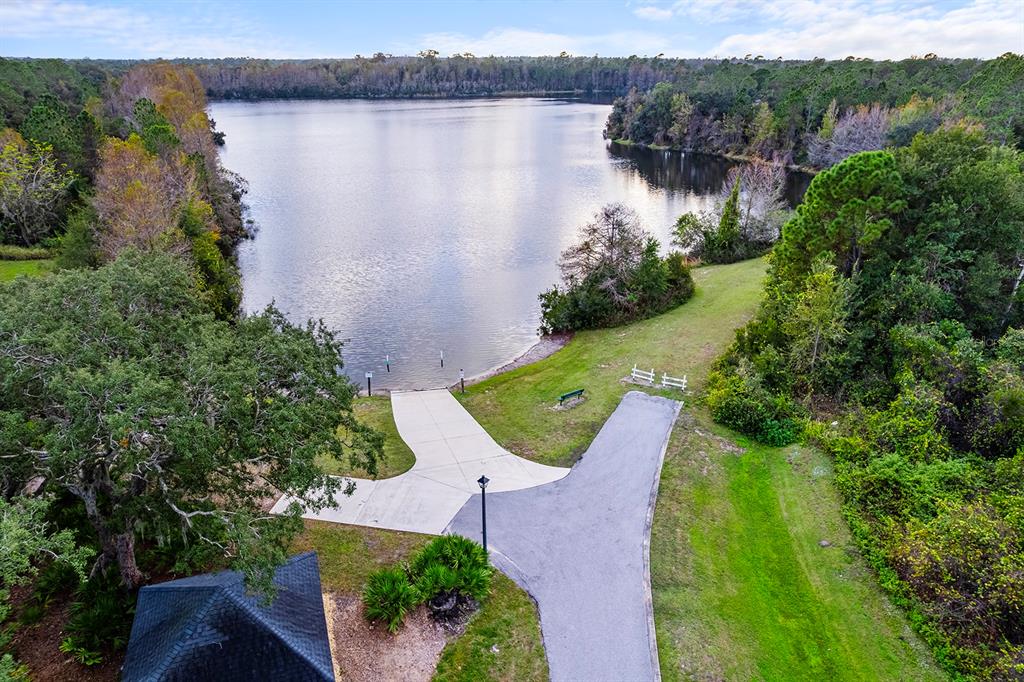 5713 Oak Lake Trail Oviedo, FL 32765 - Photo 37 of 52 an aerial view of a house with garden space and lake view