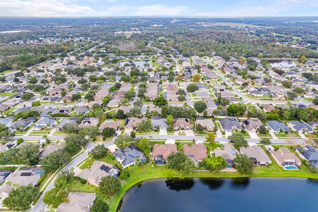 5713 Oak Lake Trail Oviedo, FL 32765 - Photo 43 of 52 an aerial view of residential houses with outdoor space and swimming pool