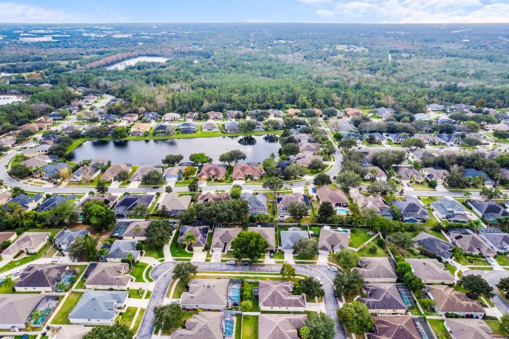 5713 Oak Lake Trail Oviedo, FL 32765 - Photo 46 of 52 an aerial view of residential houses with outdoor space and swimming pool