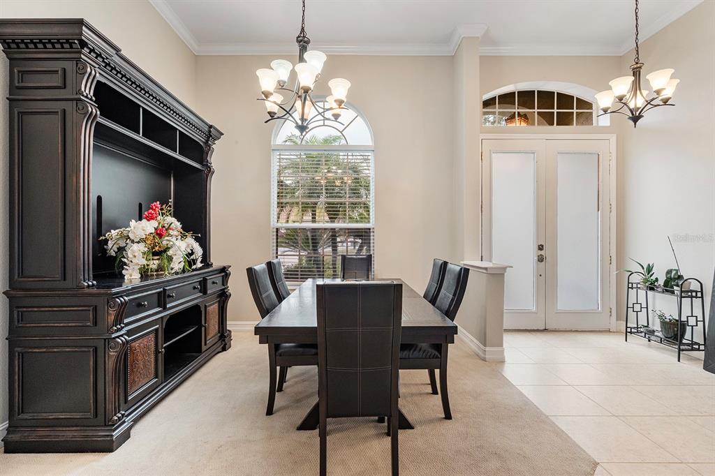 5713 Oak Lake Trail Oviedo, FL 32765 - Photo 6 of 52 a view of a dining room with furniture and chandelier