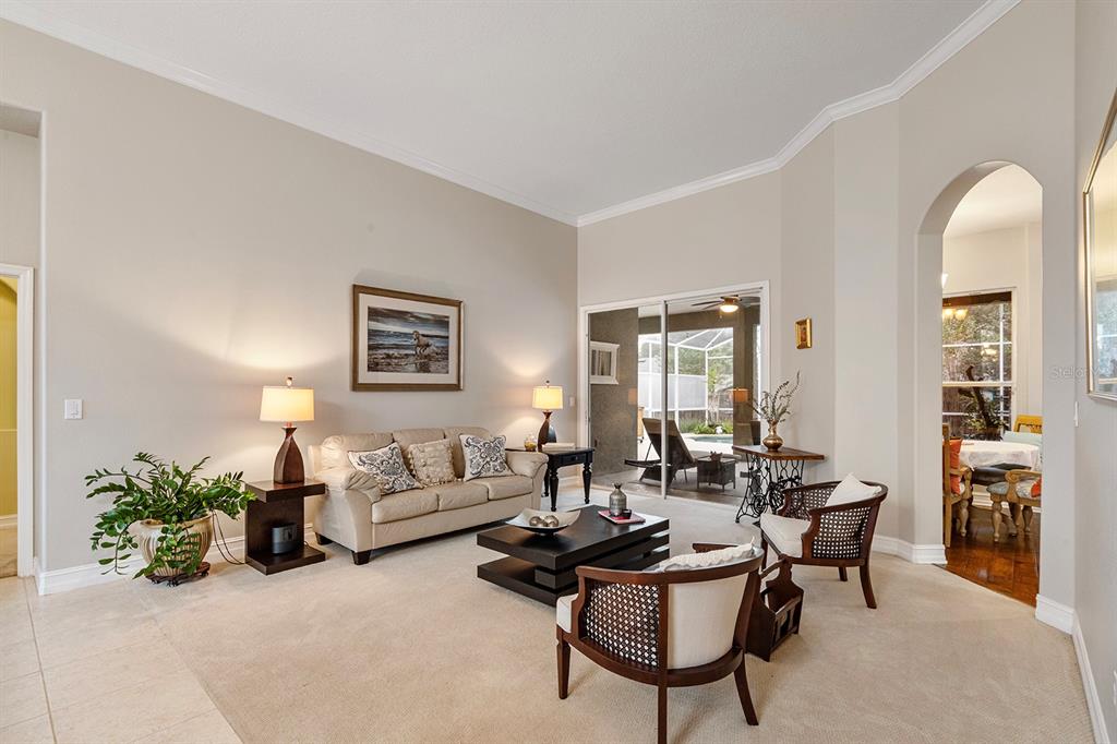 5713 Oak Lake Trail Oviedo, FL 32765 - Photo 8 of 52 a living room with furniture and a large window
