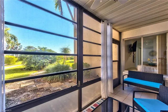 a view of two chairs in the balcony