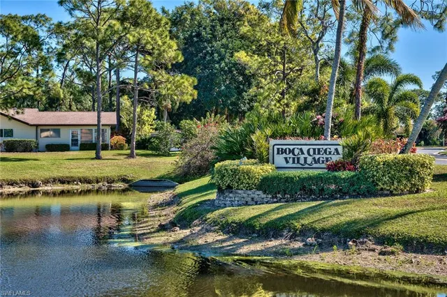 a view of a house with swimming pool and a yard