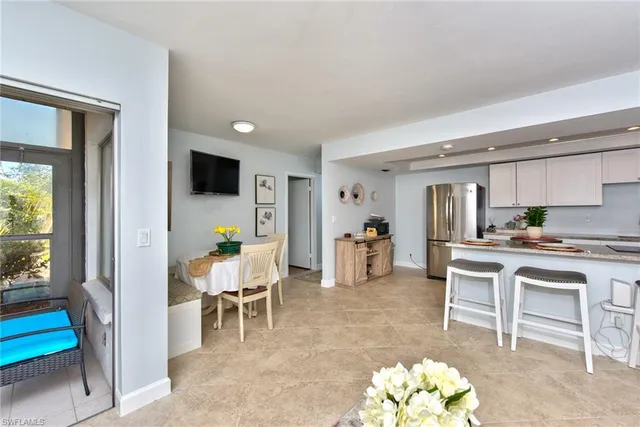 a view of a dining room with furniture window and outside view
