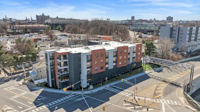 a large building with a bench in front of it