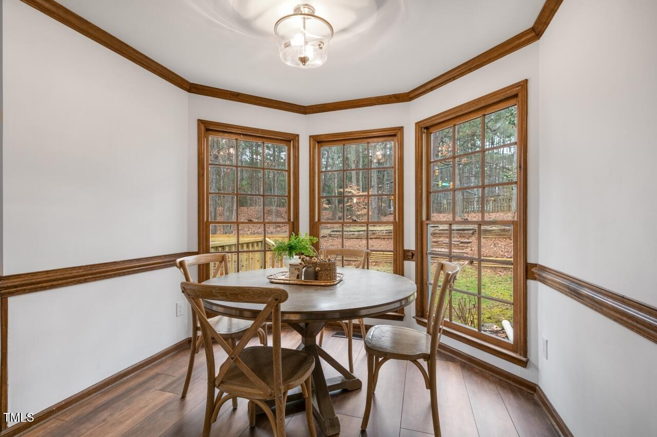 112 Ridgepath Way Cary, NC 27511 - Photo 11 of 38 a view of a dining room with furniture window and wooden floor