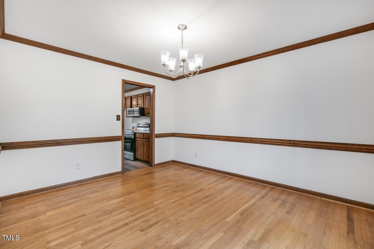112 Ridgepath Way Cary, NC 27511 - Photo 16 of 38 a view of empty room with wooden floor