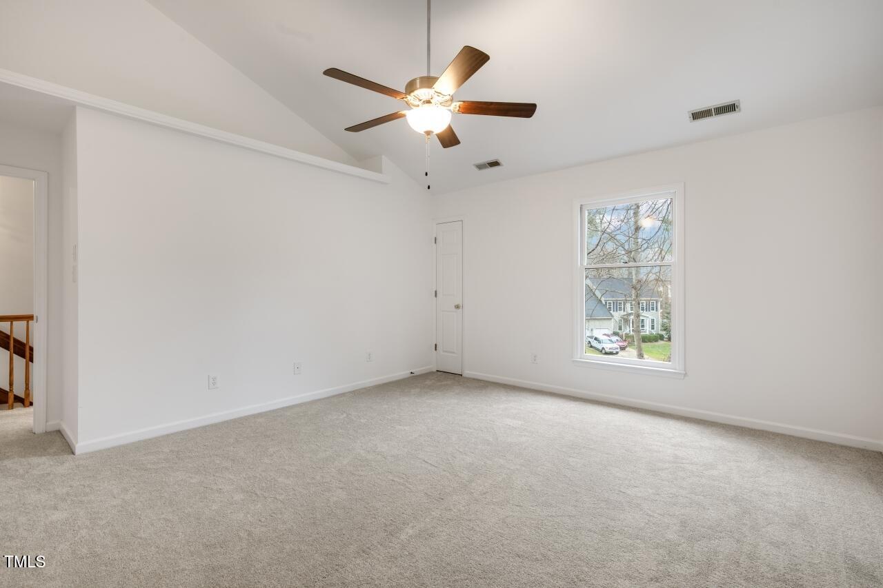 112 Ridgepath Way Cary, NC 27511 - Photo 19 of 38 an empty room with windows and fan