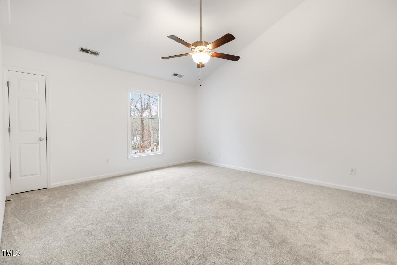 112 Ridgepath Way Cary, NC 27511 - Photo 20 of 38 an empty room with window and ceiling fan