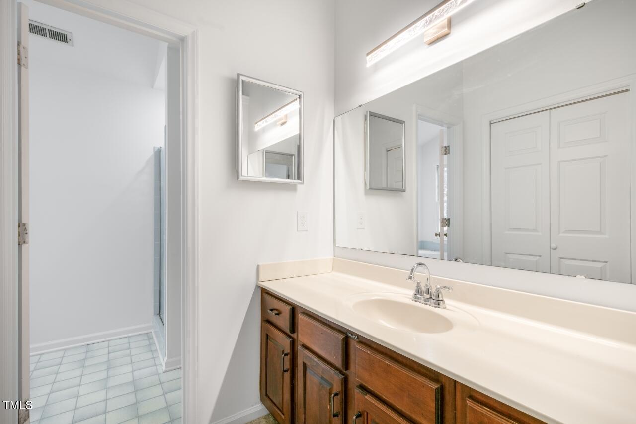112 Ridgepath Way Cary, NC 27511 - Photo 21 of 38 a bathroom with a sink and a mirror