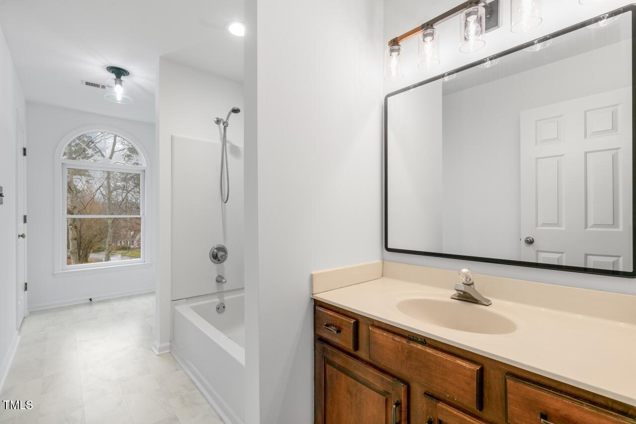 112 Ridgepath Way Cary, NC 27511 - Photo 25 of 38 a bathroom with a sink and a bathtub