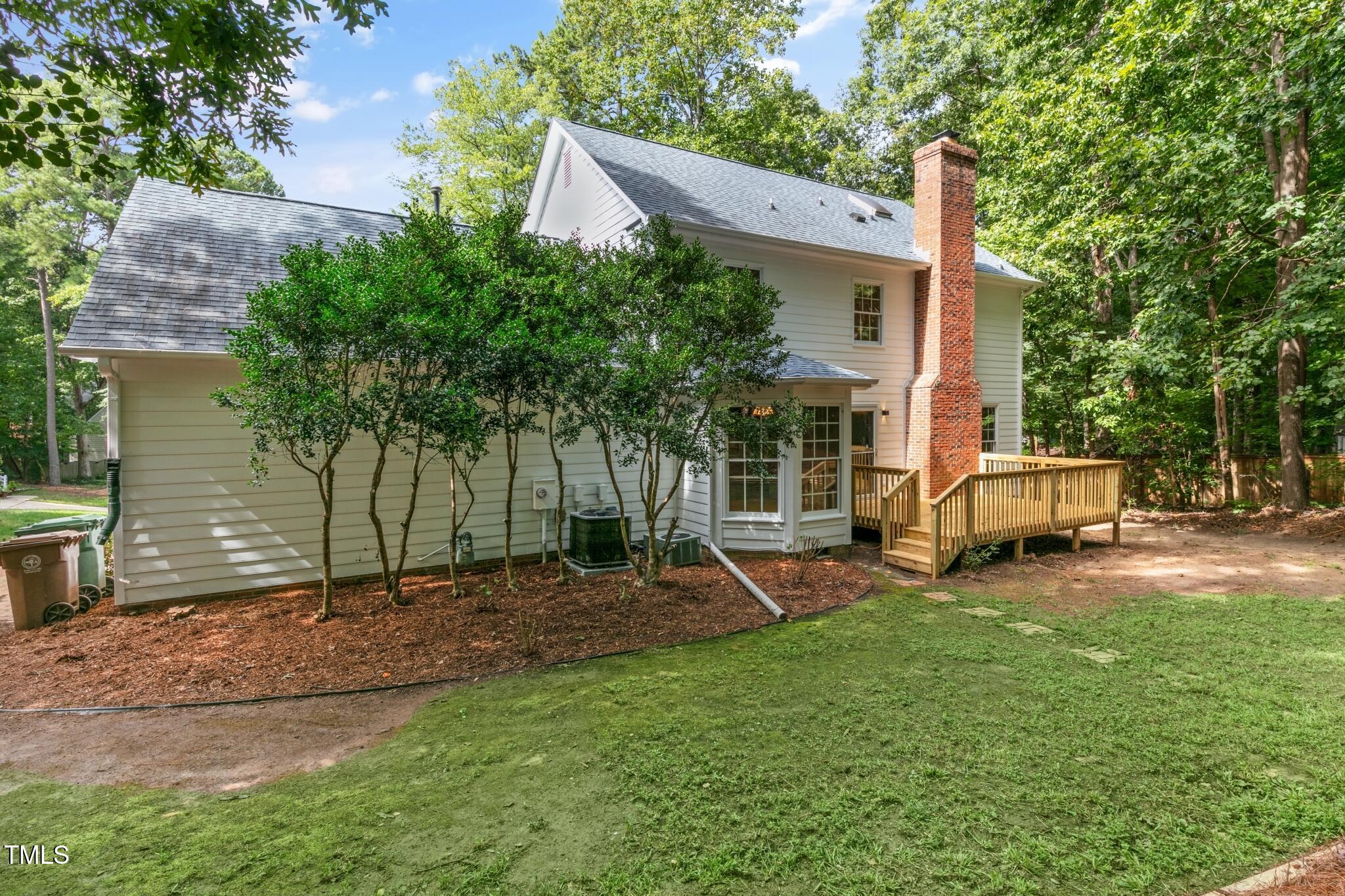 112 Ridgepath Way Cary, NC 27511 - Photo 34 of 38 a view of a house with backyard porch and sitting area