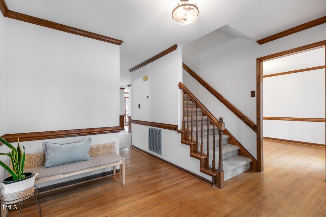 112 Ridgepath Way Cary, NC 27511 - Photo 3 of 38 a view of entryway with wooden floor and stairs