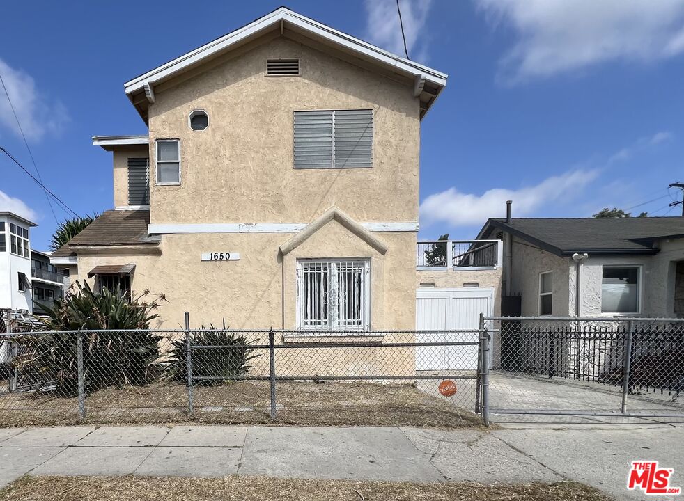 a front view of a house with garage