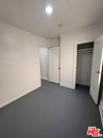 a bathroom with a toilet a sink and a mirror