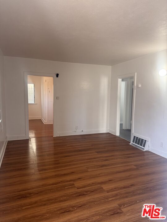 1650 South Rimpau Boulevard Los Angeles, CA 90019 - Photo 2 of 12 a view of an empty room and window