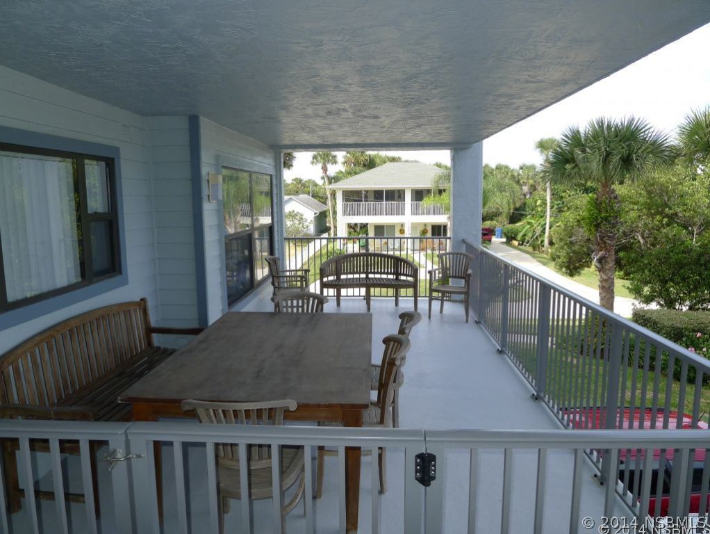 6544 Engram Road, Unit E204 New Smyrna Beach, FL 32169 - Photo 14 of 22 a view of a patio with wooden floor