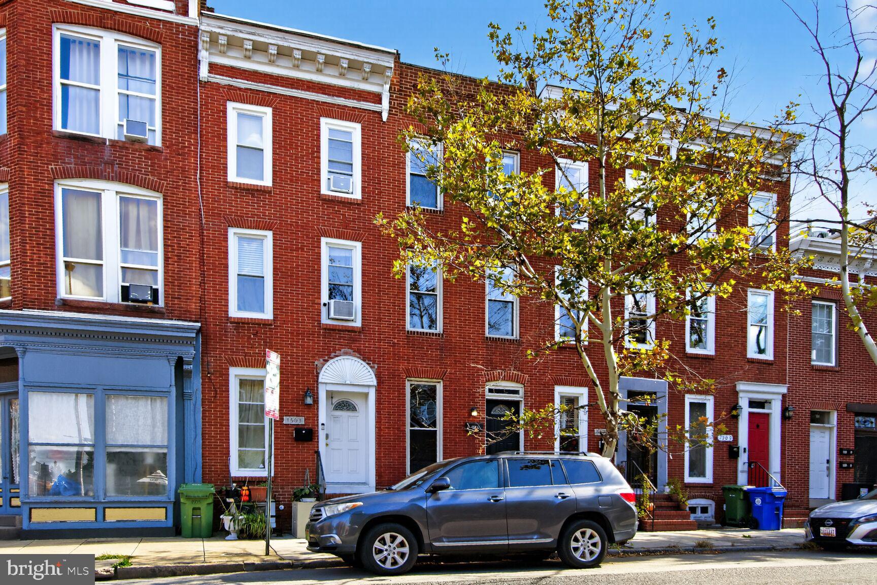 a front view of a building with parking space
