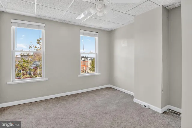 an empty room with windows