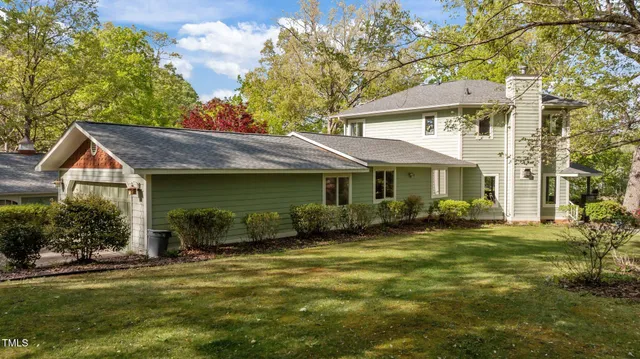 a living room with furniture a window and a flat screen tv