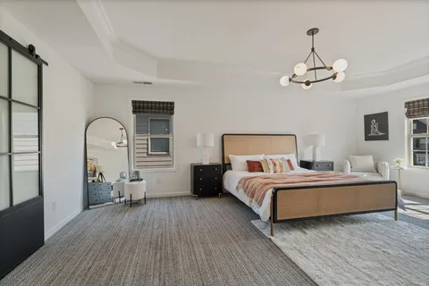 a bedroom with bed and window