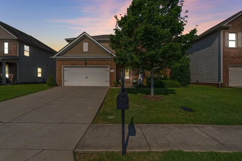 a front view of a house with a yard