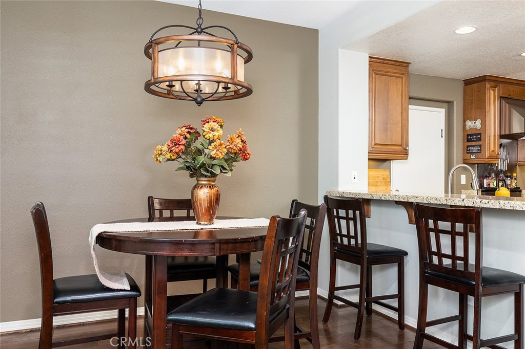 453 North Altadena Drive, Unit 7 Pasadena, CA 91107 - Photo 14 of 27 a dining room with furniture and chandelier