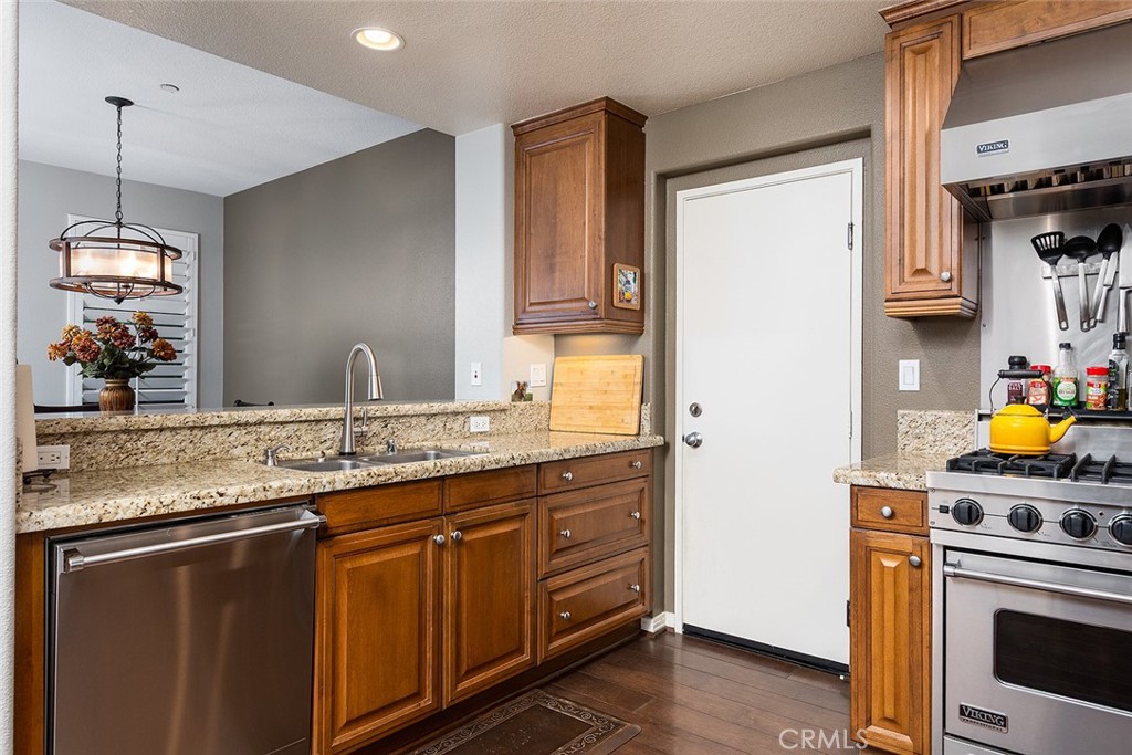 453 North Altadena Drive, Unit 7 Pasadena, CA 91107 - Photo 15 of 27 a kitchen with stainless steel appliances granite countertop a sink a stove and a refrigerator