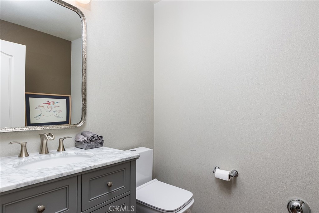 453 North Altadena Drive, Unit 7 Pasadena, CA 91107 - Photo 17 of 27 a bathroom with a granite countertop sink mirror and vanity
