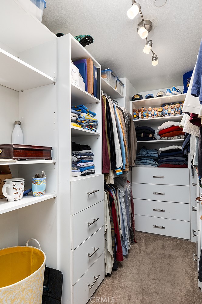 453 North Altadena Drive, Unit 7 Pasadena, CA 91107 - Photo 22 of 27 a view of walk in closet with clothes and shoes