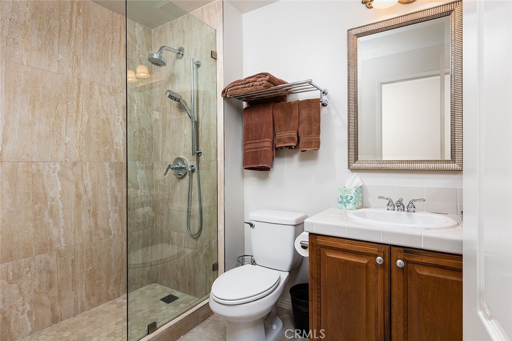 453 North Altadena Drive, Unit 7 Pasadena, CA 91107 - Photo 24 of 27 a bathroom with a granite countertop sink toilet and shower