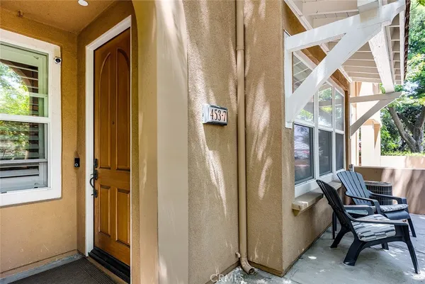 a view of a door and chair in a room