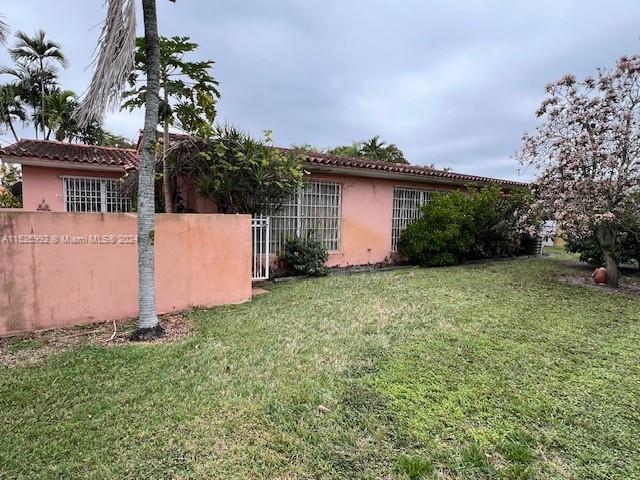 8253 West 14th Court Hialeah, FL 33014 - Photo 12 of 13 front view of house with a yard