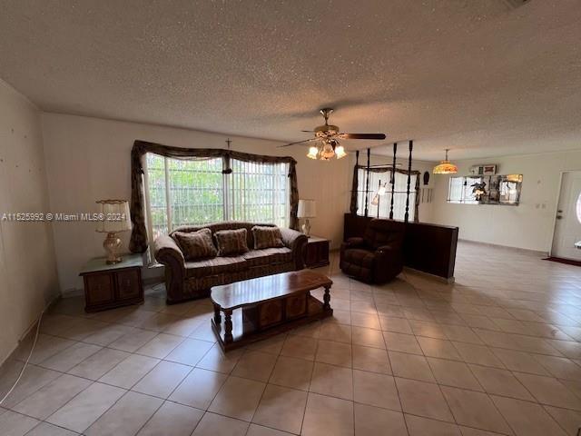 8253 West 14th Court Hialeah, FL 33014 - Photo 5 of 13 a living room with furniture and chandelier