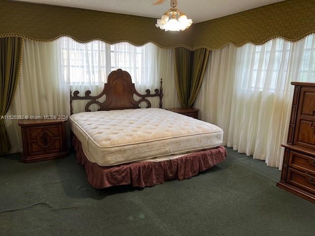 8253 West 14th Court Hialeah, FL 33014 - Photo 7 of 13 a bed sitting in a room next to a window
