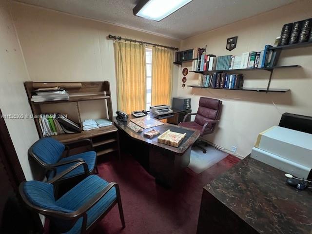 8253 West 14th Court Hialeah, FL 33014 - Photo 9 of 13 a living room with furniture and a book shelf