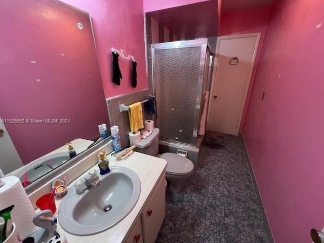 8253 West 14th Court Hialeah, FL 33014 - Photo 10 of 13 a bathroom with a sink toilet and mirror