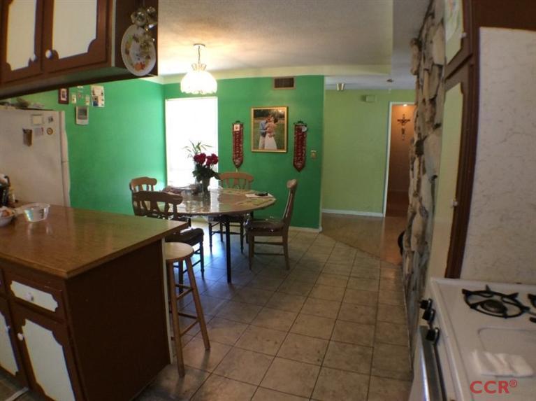4213 Rigel Avenue Lompoc, CA 93436 - Photo 4 of 13 a view of a dining room with furniture and a chandelier